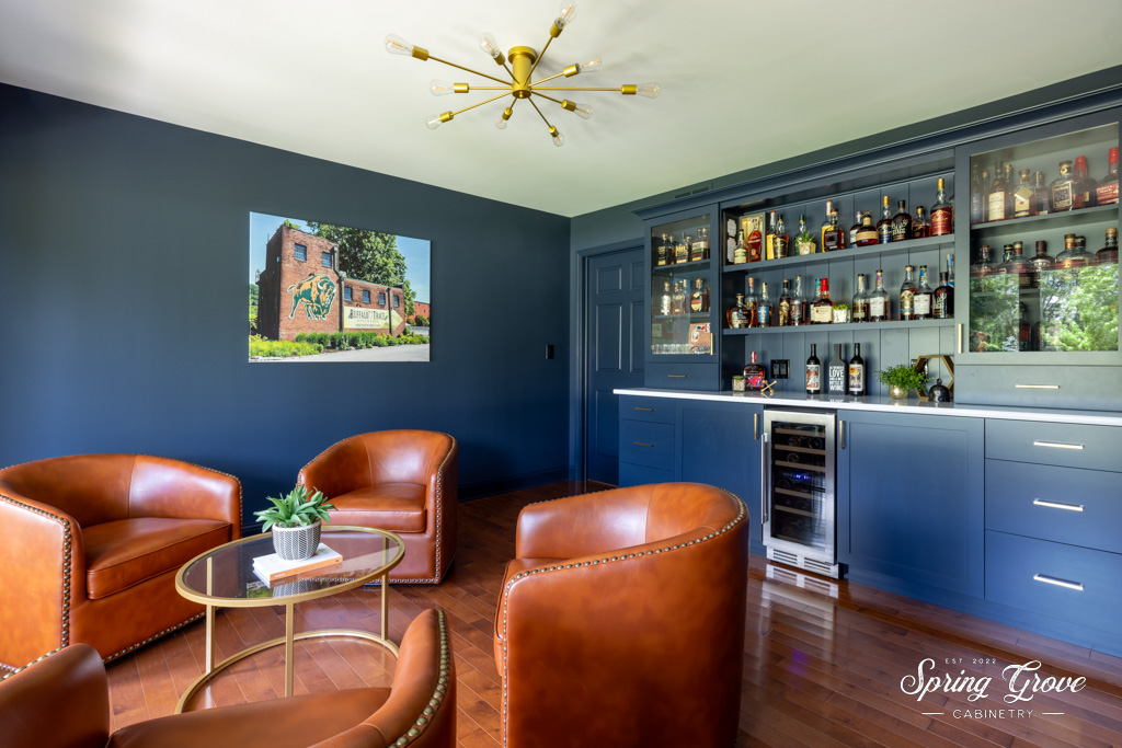 The bold rich color of nightfall flows seemlessly from the cabinets to the walls to the trim, and transforms the space into an elegant lounge.