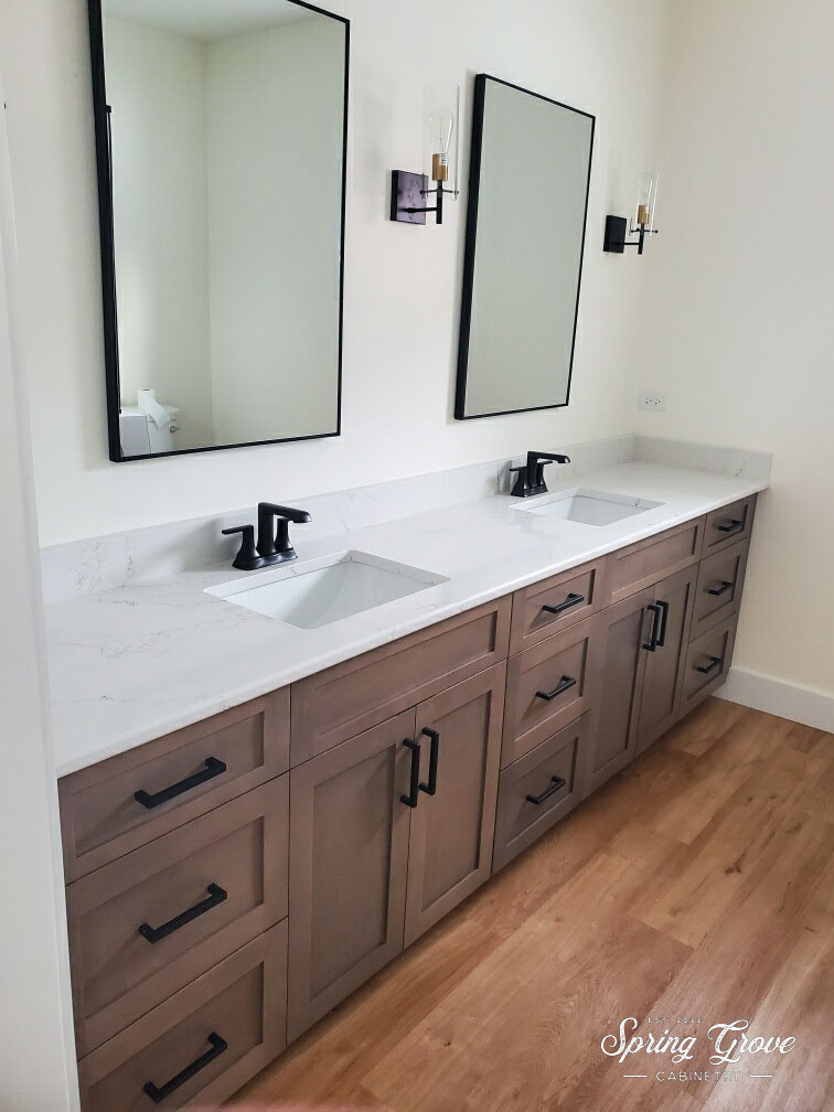 Primary bath vanity in maple with a lavastone stain color.