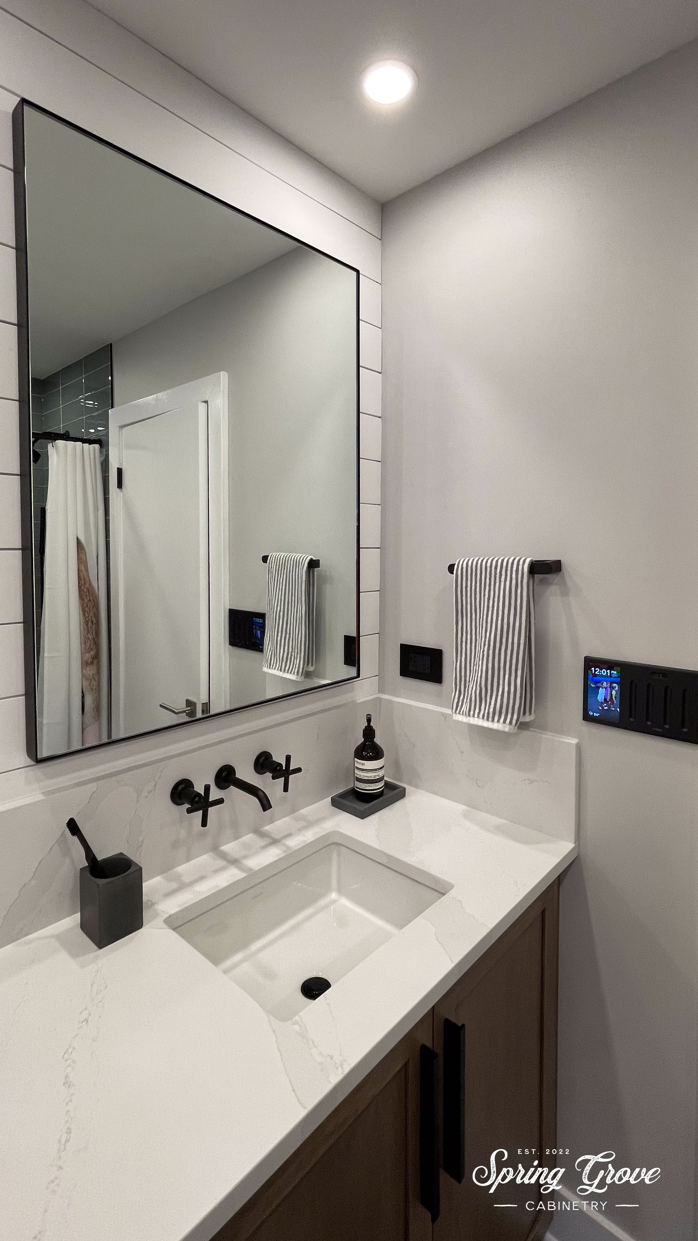 Shiplap wall behind the mirrors.