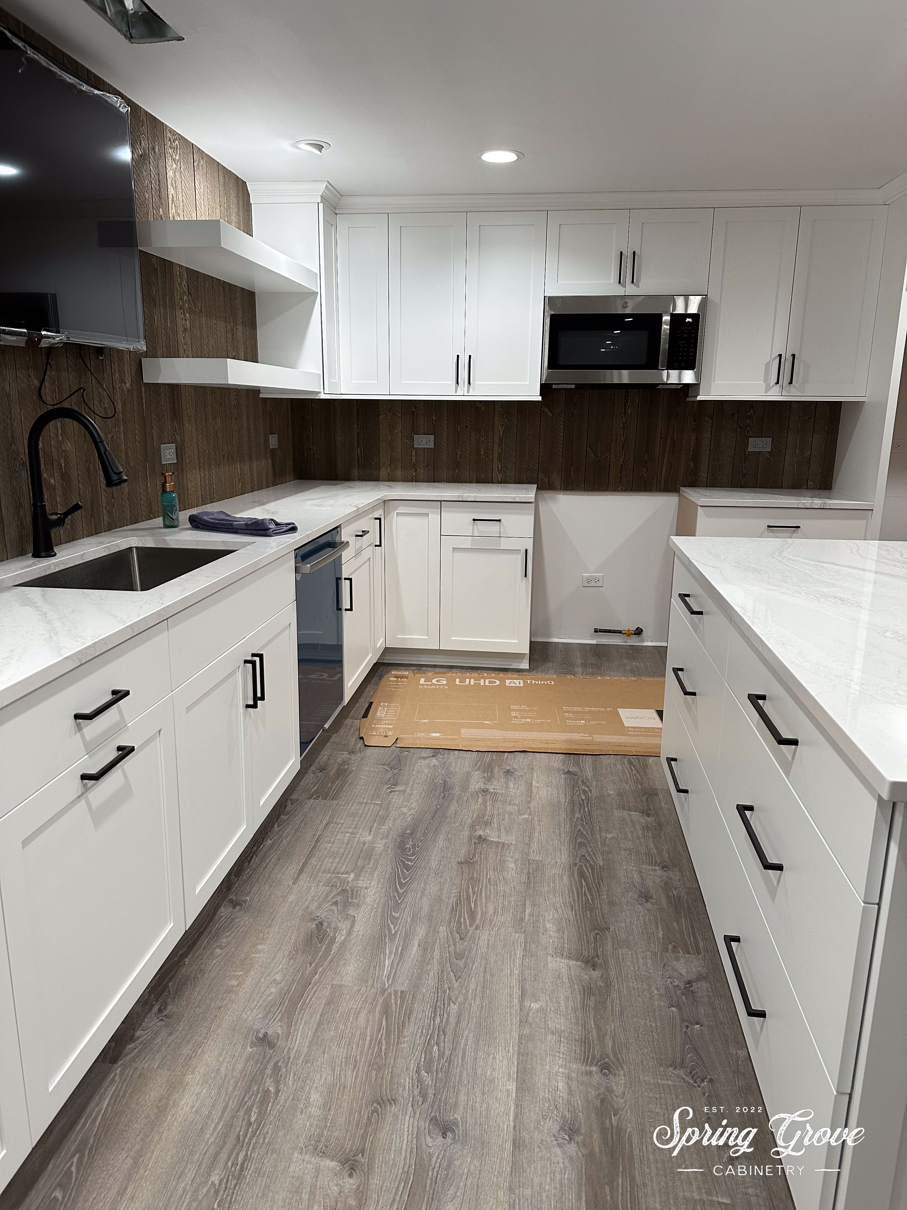 The island has divided drawer storage for wine bottles.