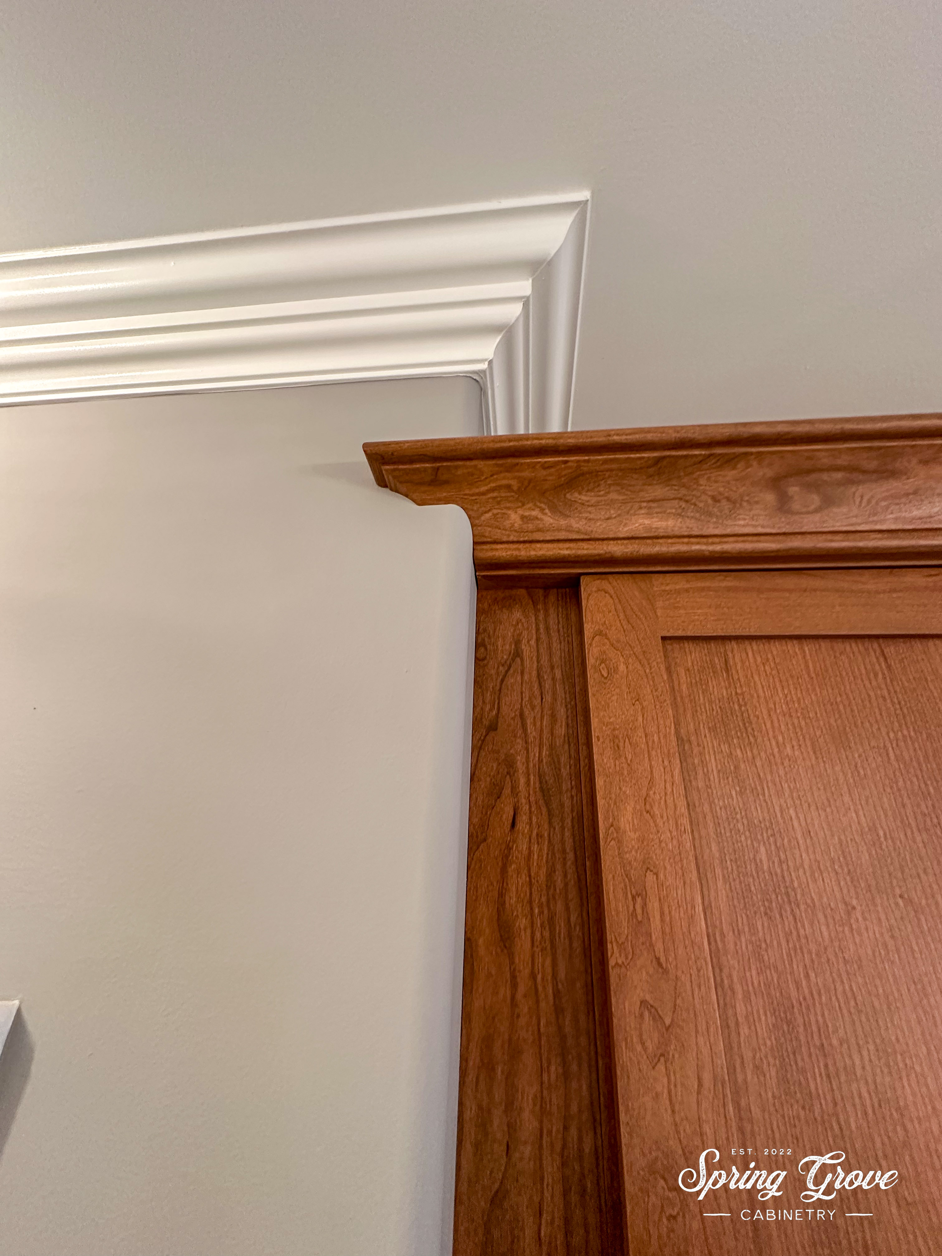 Sometimes, renovations pose unique challenges. This one required us to scribe the crown molding to the curved cornerbead of the drywall.