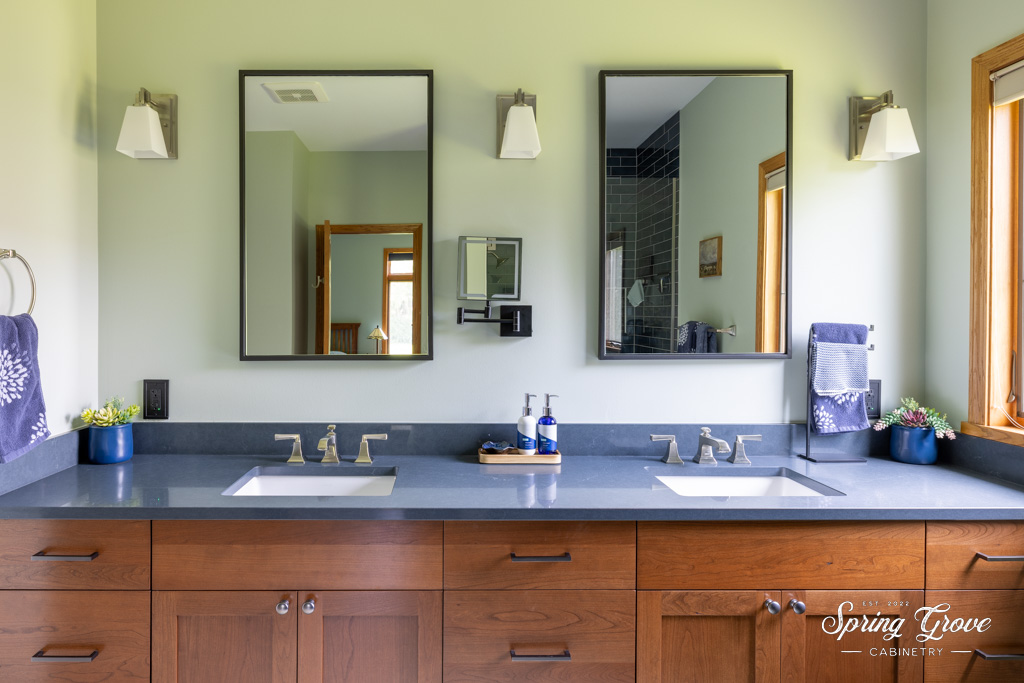 Underneath the two sinks sit nine cherry paneled drawers and two cabinets for optimal storage.