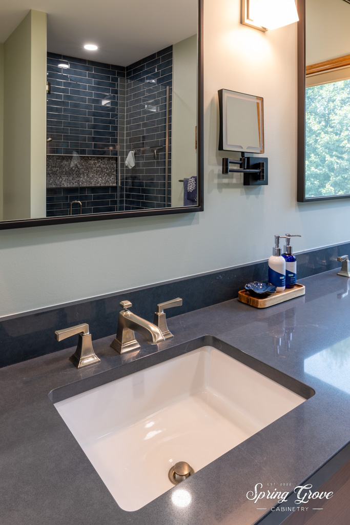 The hardwired makeup mirror moves around for any angle of need.