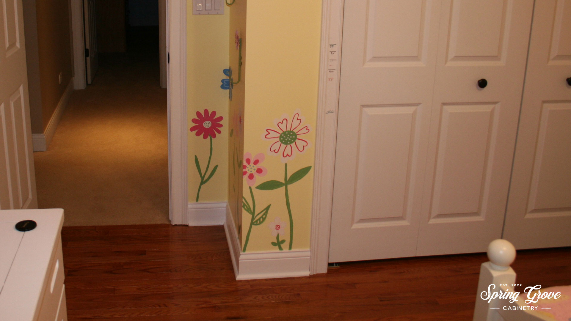 Hand painted flowers that match the bedspread.